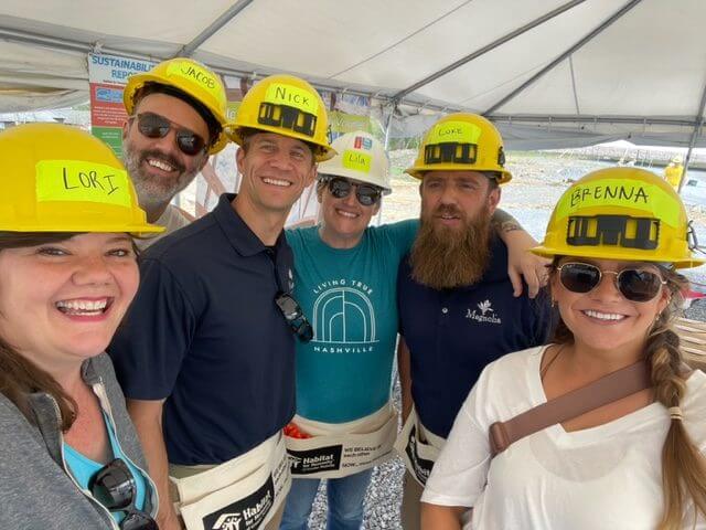 Magnolia team members volunteering at a Habitat for Humanity build